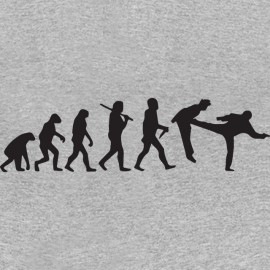 camiseta gris Chuck Norris pies Evolución en la boca